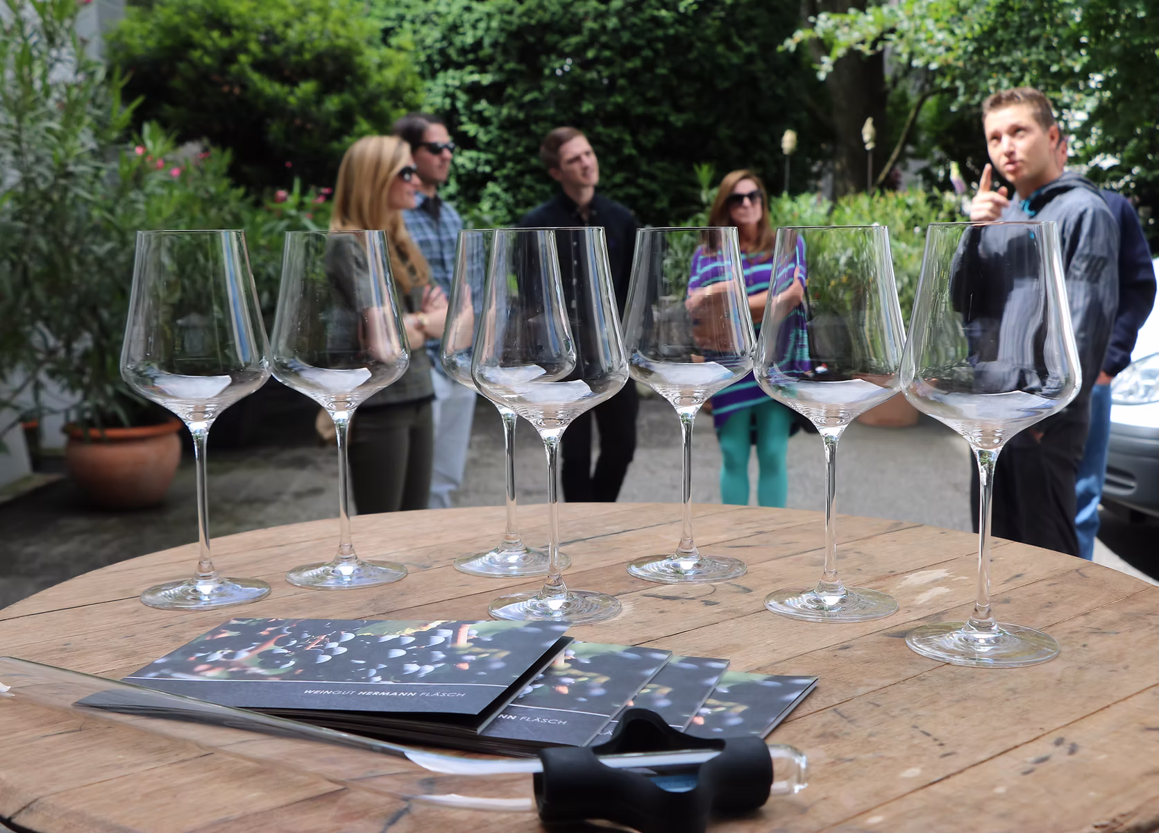 Empty wine glasses arranged on a table during a vineyard wine tour in Grisons, Switzerland