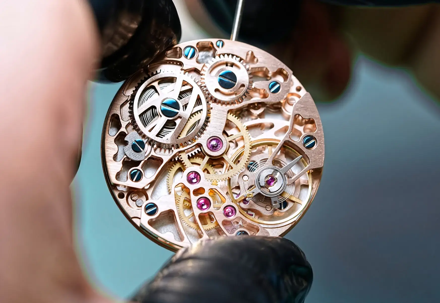 Detailed close-up of a luxury Swiss watch movement and intricate mechanical dial components